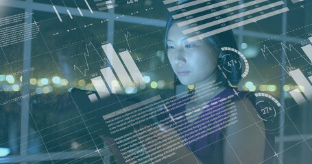 Asian woman, 22, wearing glasses, examining digital data on transparent screen