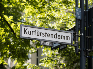Kurfürstendamm street sign in Berlin, Germany also known as Kudamm. The road is popular for shopping and luxury boutiques like designer fashion, jewellery and other products. © Felix Geringswald