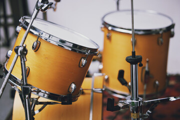 Art, drums and music with instrument set in recording studio for creative, retro or vintage production. Entertainment, equipment and sound with percussion kit closeup on stage for audio performance