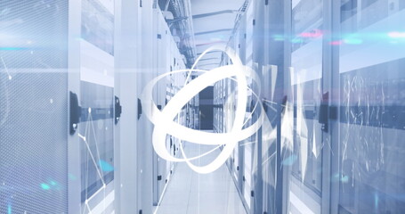 Image of rotating abstract pattern with geometric shape and lens flare over server room