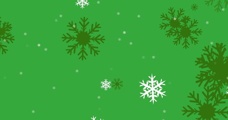 Image of snowflakes icons falling against green background with copy space