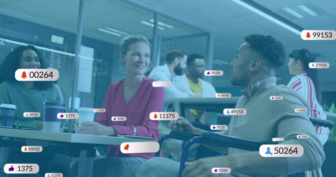 Image of social media icons with numbers over diverse business people having meeting at office