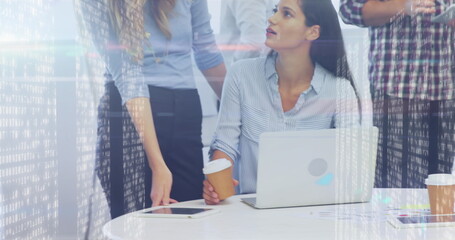 Image of screens with mosaic squares over diverse colleagues discussing together at office