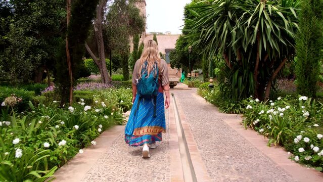 Rabat - Morocco: European blonde girl walking in Kasbah of Udayas fortress in Rabat. Kasbah Udayas is ancient attraction of Rabat Morocco, near Bou Regreg river.
