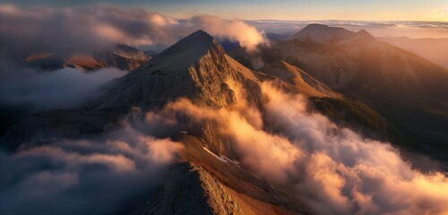 A majestic mountain peak bathed in the golden light of sunset, with a blanket of clouds rolling through the valley below 32k, full ultra hd, high resolution