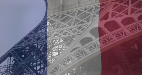 Image of flag of france over eiffel tower