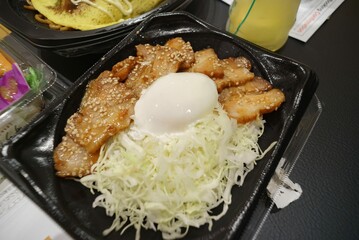 Rice with pork belly stir-fried with sauce and soft-boiled egg