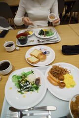 Japanese breakfast on wooden table at hotel dining room