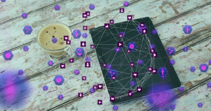 Image of icons and connected icons forming globe over coffee and digital tablet on table - Powered by Adobe