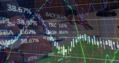 Image of multiple graphs and trading board, caucasian coworkers discussing on desk