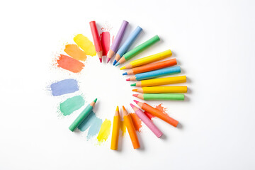 Colorful pencils and watercolor strokes arranged in a circle on a white background. This image is perfect for projects related to art, creativity, education, and childhood. 