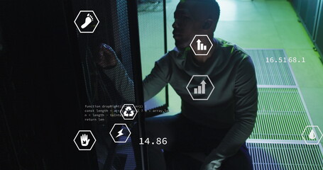 Image of digital icons, data processing on african american male engineer working at server room