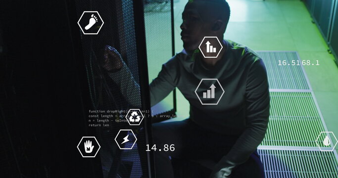 Image of digital icons, data processing on african american male engineer working at server room