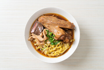 egg noodles with stewed and braised duck in brown soup