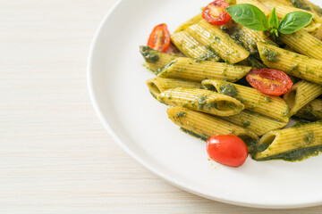penne pasta with pesto sauce and tomatoes
