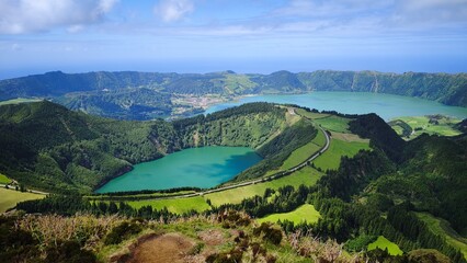 kes in a volcanic crater, green meadows and forests, fantastic natural scenery. The Azores.