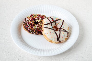 Tasty donut with chocolate glaze and sprinkle