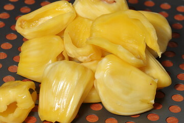 Fresh ripe jackfruit. Fresh sweet jackfruit segment ready for eat. Cutting jackfruit. Tropical fruit.