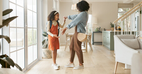 Morning, mother and daughter with dancing in home for happiness, school bag and love relationship...