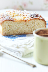 Simple yeast cake on bright background. Front view. Close up.