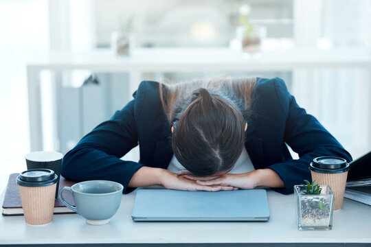 Woman, desk and sleep for burnout or tired, fatigue and exhausted corporate worker in office. Nap, overworked and deadline for project manager person, coffee and workload pressure and low energy
