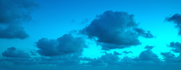 Cloudy sky at sunset. Sky texture. Abstract nature background. Horizontal banner