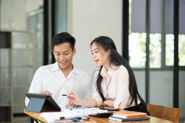 Asian businessmen, women and men Talk about new projects, presents at home office.