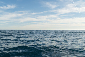Sea travelling background of empty horizon with sunny weather