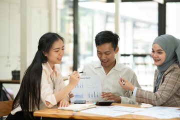 Asian businessmen, women and men Talk about new projects, presents at home office.
