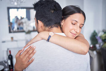 Couple, hug and together in home for support, love and forgiveness in lounge after fight. Woman,...
