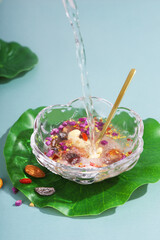 Nutritious breakfast made of dried lotus root powder and whole grains, indoor white background, nutritious porridge and healthy food