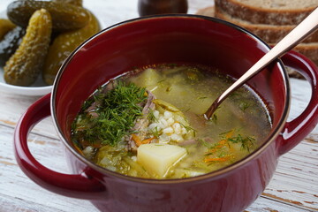 Soup with beef meat, pickled cucumbers and pearl barley.  Rassolnik- traditional Russian cuisine cucumber soup