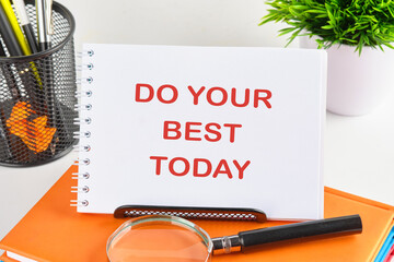Business motivational. Do your best today symbol on a blank sheet next to the magnifying glass