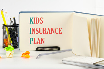 KIP kids insurance plan symbol on a blank sheet of an open business notebook