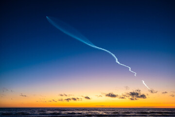 Falcon 9 launch observed at Torrey Pines beach with a beautiful sunset as backdrop.