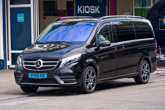 Freshly cleaned Dutch Mercedes minivan taxi of Trusted Transfers Amsterdam company at Swiss City of Z&uuml;rich on a blue cloudy spring day. Photo taken May 24th, 2024, Zurich, Switzerland.