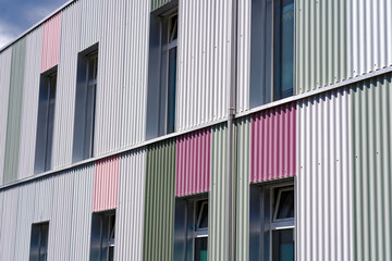 Close-up of corrugated sheet iron with colors at Swiss City of Zürich on a blue cloudy spring day. Photo taken May 24th, 2024, Zurich, Switzerland.