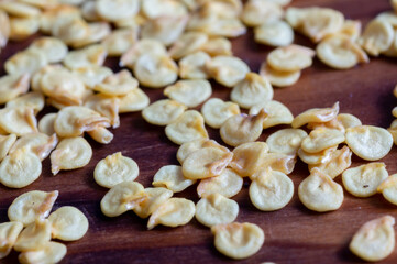 Pepper seeds on wooden background. Vegetable garden concept