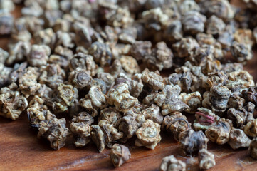 Beet seeds on wooden background. Vegetable garden concept