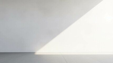 Minimalist interior space featuring clean white walls and natural light, creating a serene and simple atmosphere. Ideal for backgrounds.