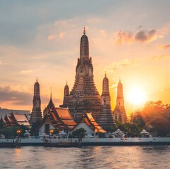 Fototapeta premium Thai Buddhist temple in the rays of the setting sun