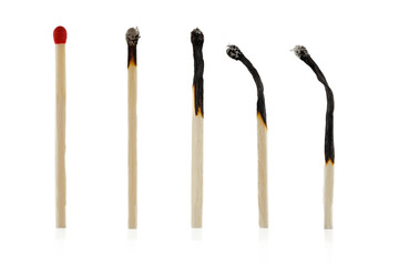Burnt matches isolated on white. Box of matches. Different stages of match burning Burnt matches. Full depth of field.