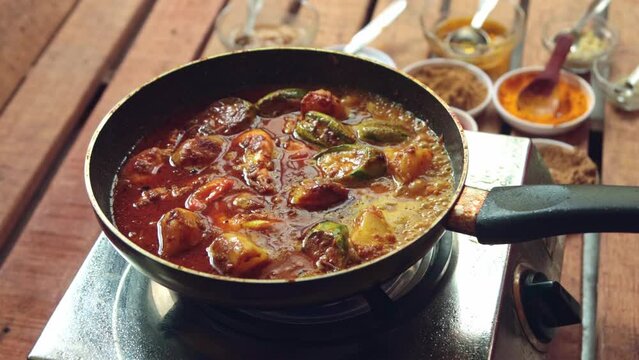 cooking pointed ground or potol or parwal shrimp curry with potato