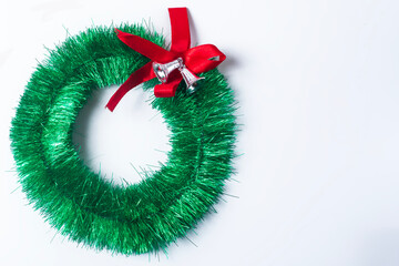 Christmas wreath with red bow isolated on white background