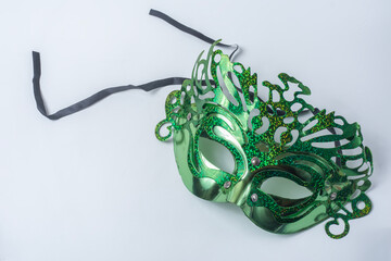 Green carnival mask isolated on white background