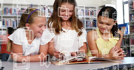 Image of multiple icons over diverse female girl reading book with friends in library at school