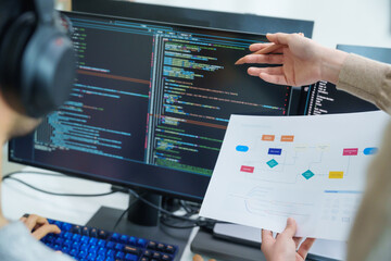 close up developer discussion about app flowchart coding at desk in modern office