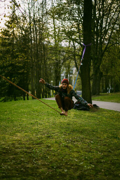 Young man balancing on slackline.