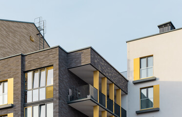 Architectural housing in city apartment, modern urban residential exterior. Window sky balcony facade new estate, buildings blue structure construction development day. Home