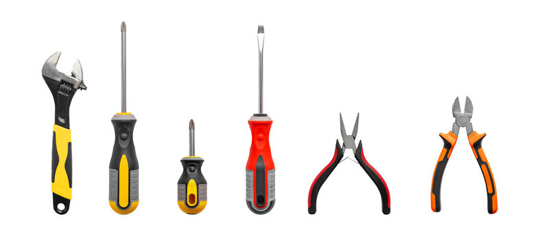 Equipment set isolated on white background, including metallic screwdriver, work tool, steel object for repair. Industrial mechanic hardware, red hand instrument, closeup, transparent background